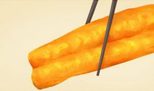 女人梦见自己吃油条是什么意思